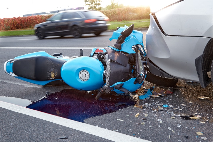 October 6, 2021, Riga, Latvia, damaged car and motorbike on the city road at the scene of an accident because of non-observance of distance